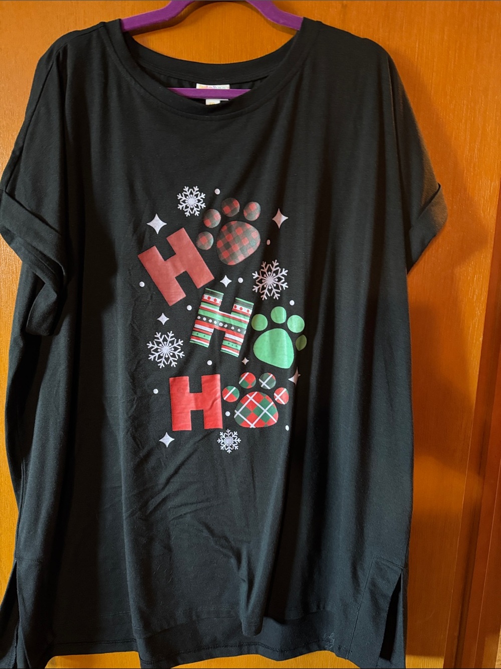 LuLaRoe Leah Black Holiday Paw Print Graphic Tee with Red & Green Accents